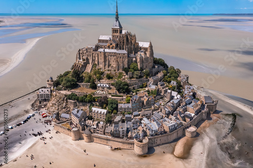 Aerial view with the spectacular Mont Saint Michel, rock island and cathedral, a famous landmark in Normandy France