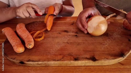 Senior couple preparing fresh vegetables for healthy meal together