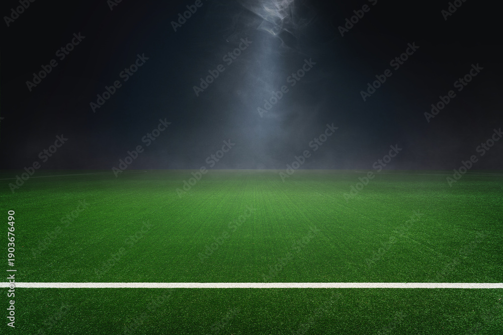 Obraz premium textured soccer game field with isolated, free copy space background - stadium center, midfield