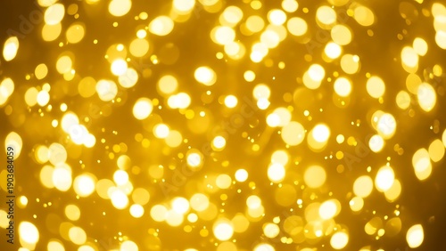 Golden bokeh lights background with numerous small and large circles of light blurry