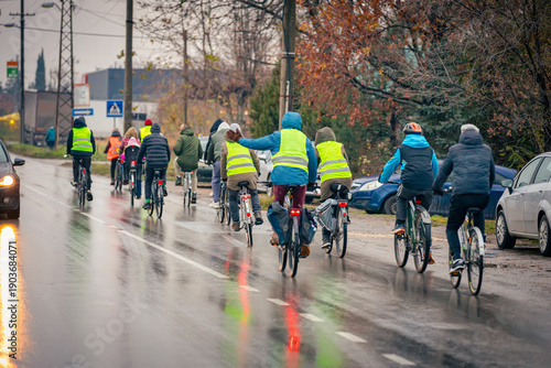 Group of cyclists on city road, street, asphalt