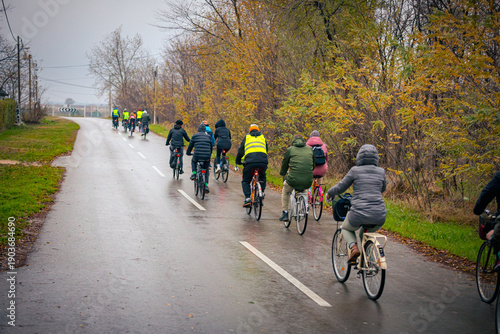 Group of cyclists on city road, street, asphalt