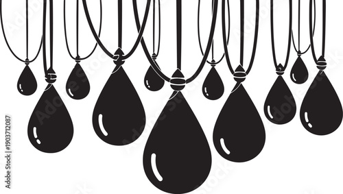Black teardrop pendants hanging on necklaces in a row