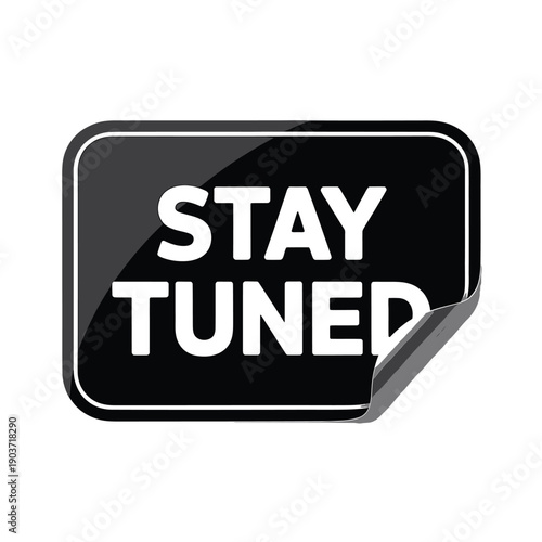 Black sign with white text reading stay tuned on a white background
