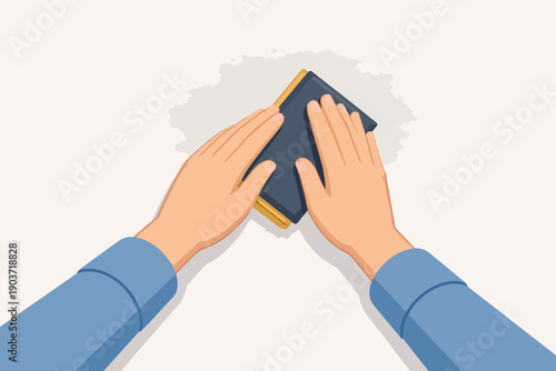 Hands sanding a surface with sandpaper block for renovation or diy project