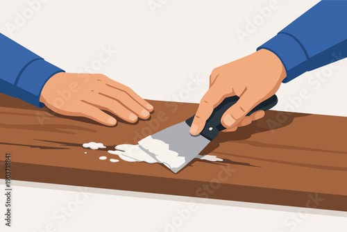 Hands applying wood filler to repair and restore wooden furniture surface