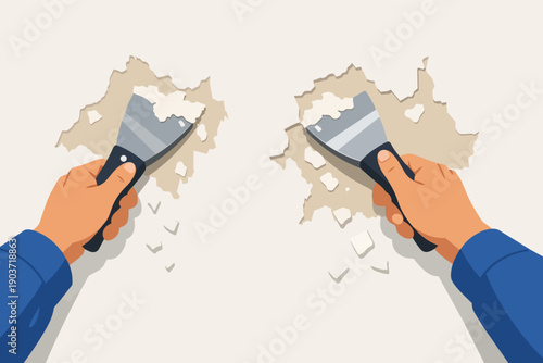 Hands using spatulas scraping peeling paint from a wall, renovating an old surface