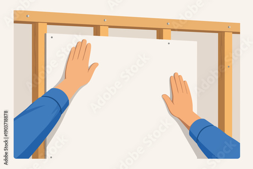 Hands installing drywall on wood stud frame, home renovation and construction