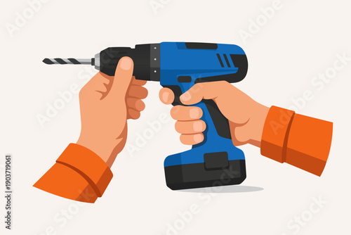 Hands holding cordless drill for repair, construction, and diy tasks