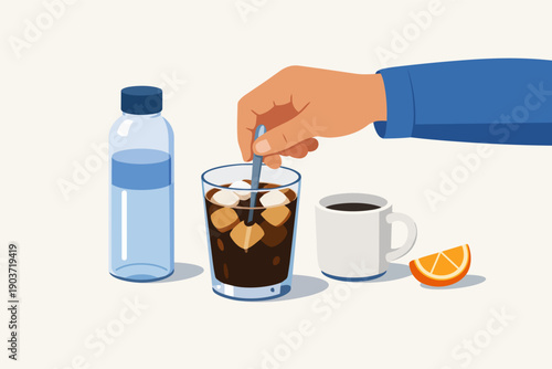 Hand stirring iced coffee in a glass, preparing a refreshing cold beverage