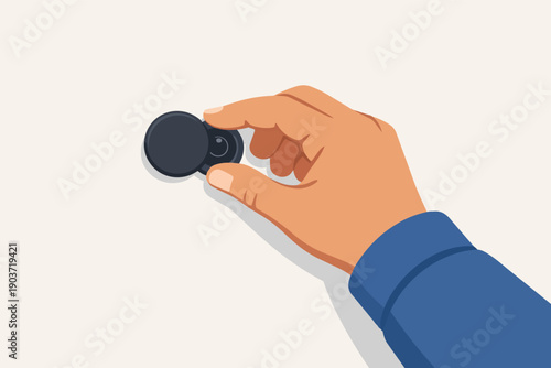 Hand holding privacy shutter of door peephole, looking through spy eye lens