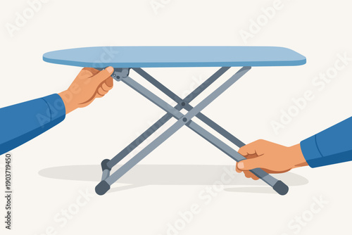 Hands adjusting ironing board legs, setting up household laundry chore equipment