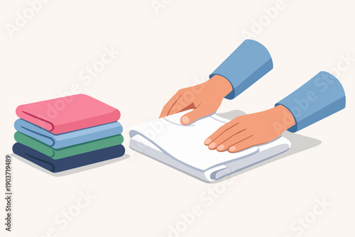 Hands folding clean laundry, organizing clothes, household chores routine