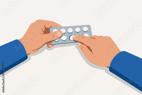 Hands holding blister pack with pills, pushing out medication for treatment