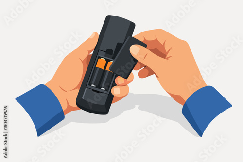 Hands changing batteries in a universal remote control for electronic devices