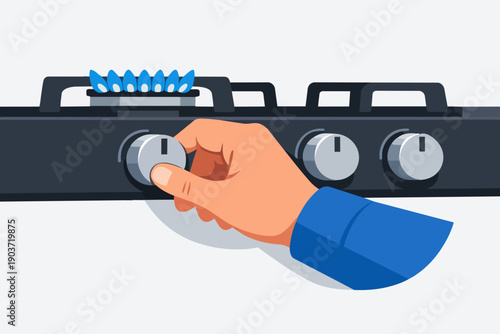 Hand turning gas stove knob, igniting blue flame for cooking food in kitchen