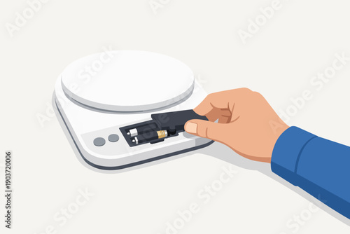 Hand installing battery in electronic kitchen scale for power and maintenance