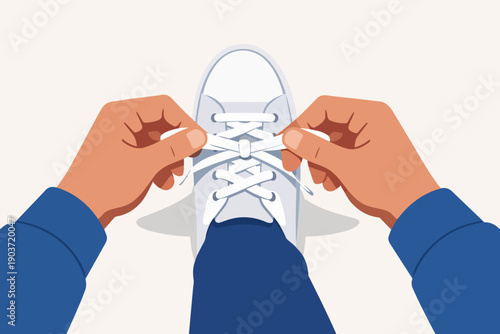 Person tying shoelaces of white sneaker, preparing for activity