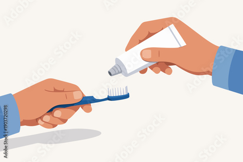 Hands applying toothpaste onto a toothbrush for daily oral hygiene routine