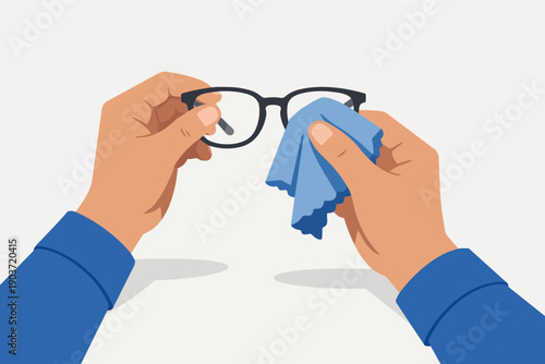 Person cleaning vision correction glasses with a microfiber cloth for clear sight