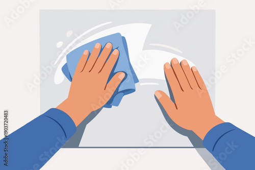 Person cleaning surface with a cloth, maintaining hygiene and sanitation
