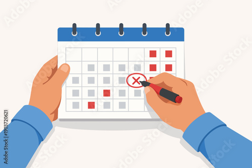 Hands marking a critical date on a calendar, important schedule planning