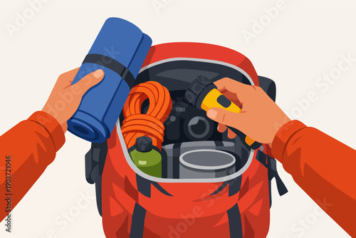 Hands packing essential gear into a backpack for hiking and outdoor adventure