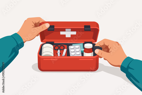 Person opening a red first aid kit with medical supplies for emergency treatment