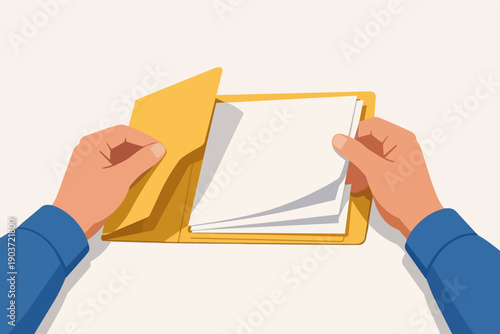Hands filing documents into a folder, managing paperwork and organization from above
