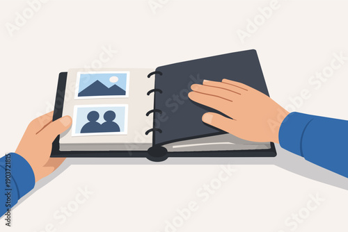 Hands holding and opening a photo album, remembering family memories and past moments