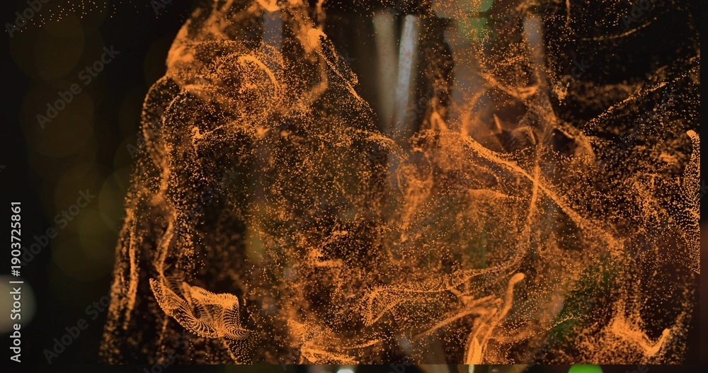 Fototapeta premium Swirling amber particle cloud filling dark studio, filaments, clusters, bokeh, vertical streak