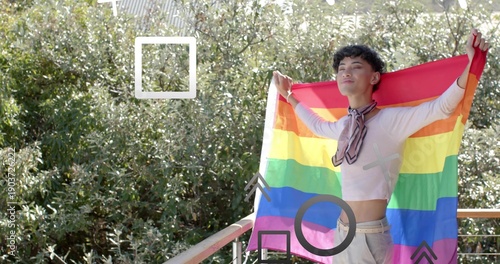 Spreading male posing on right balcony with rainbow pride flag, wearing crop top, scarf, copy space