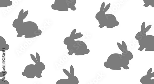 Seamless bunny rabbit vector clipart pattern in gray silhouette for Easter and spring designs