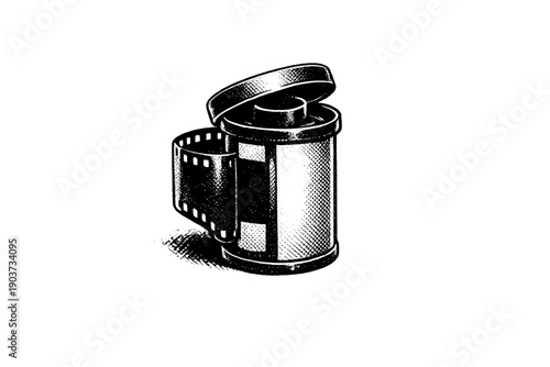 35mm Film Canister. 35mm film canister with lid slightly open, emerging from black as a solitary object, metaphor for