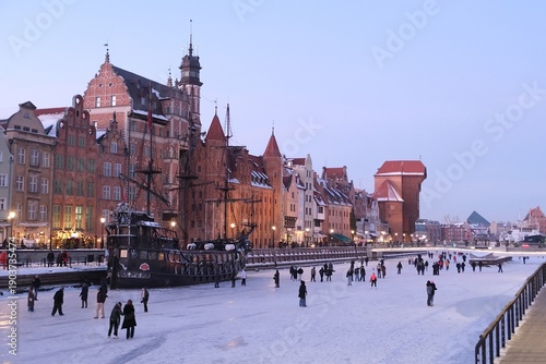 Wallpaper Mural Frozen Motlawa River in Old Town of Gdansk in evening scenery and a lot of people walking on ice. Torontodigital.ca
