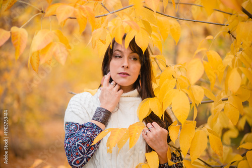 Golden Autumn: Harmony of Nature and Humanity. A Woman Among Leaves in Autumn