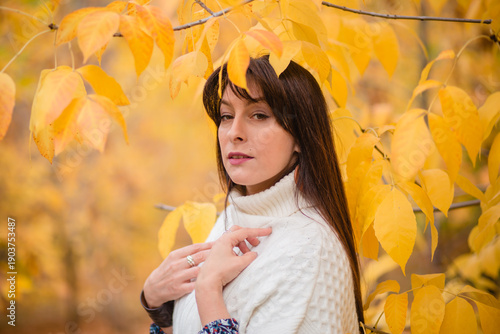 Golden Autumn: Harmony of Nature and Humanity. A Woman Among Leaves in Autumn