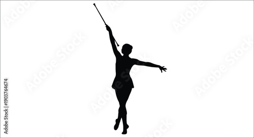 Rhythmic gymnast performing with a ribbon a striking black silhouette