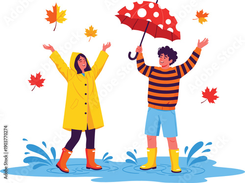 Happy couple in raincoat and boots splashing in puddles with umbrella and falling leaves for autumn season concept