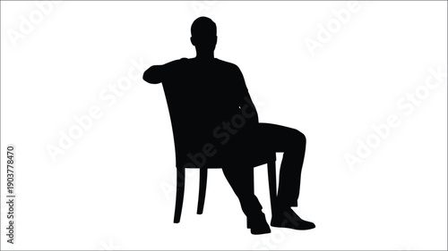 A man sits in a chair depicted as a dark silhouette