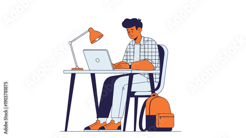 Focused young man sitting at a desk and typing on a laptop with a desk lamp and a backpack nearby in a productive work environment.