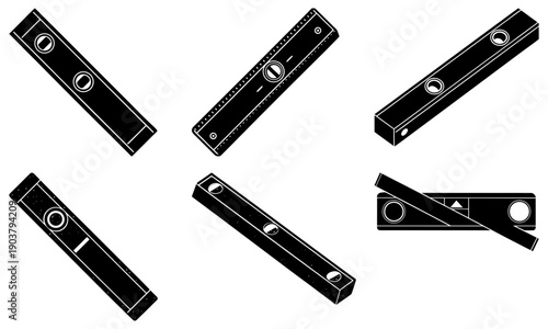 Various industrial tools arranged in a circular pattern on a plain surface viewed from directly above