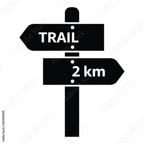 Black and white trail sign with 2 km distance marker hiking direction arrow des