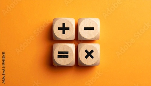Wooden blocks with math symbols on orange background