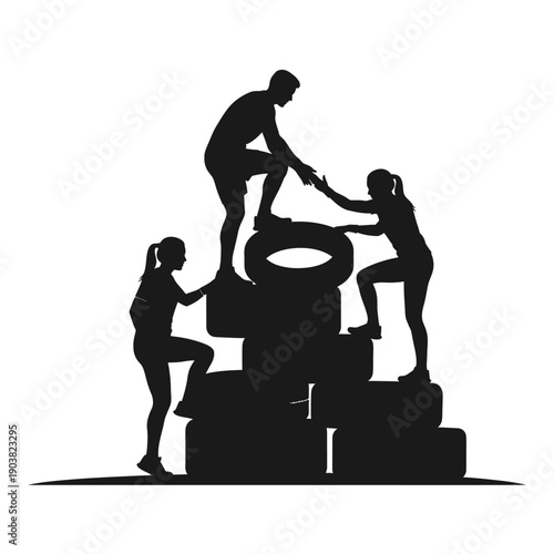 Silhouette of people assisting each other over tire obstacles during fitness training