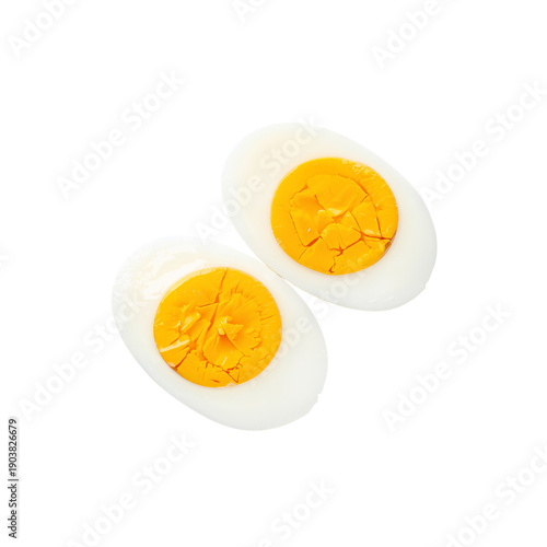 Hard Boiled Egg Cut in Half Showing Yellow Yolk on White Background