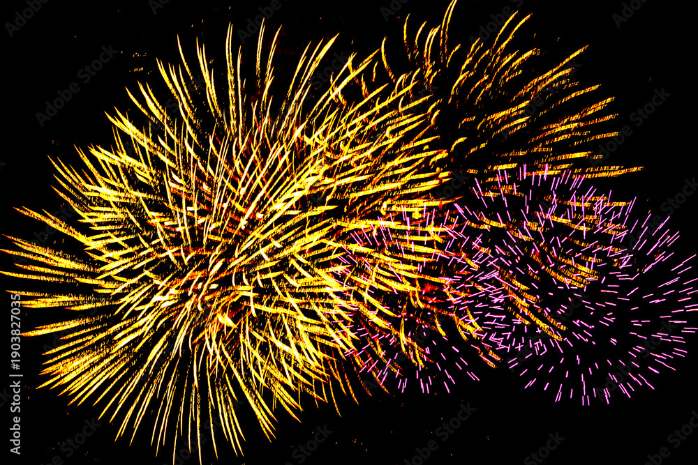 Fototapeta premium Colorful New Year fireworks on a black sky background