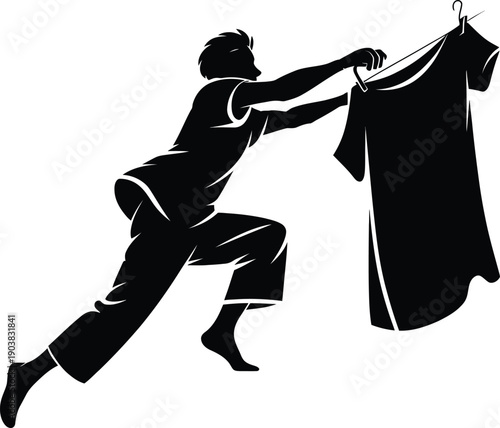 silhouette of a man holding a cloth 