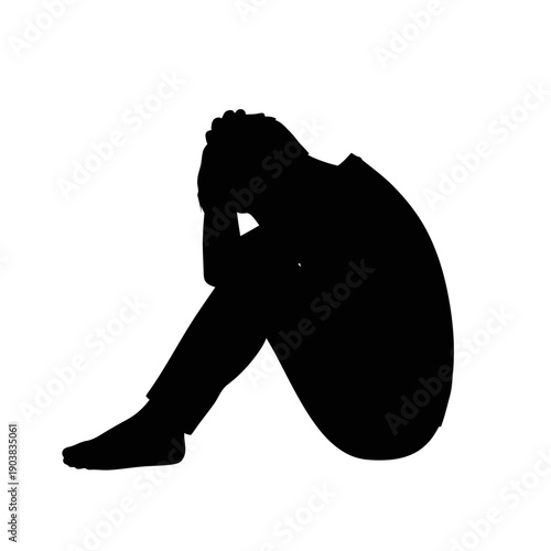 Silhouetted figure exudes sadness and despair in isolated setting