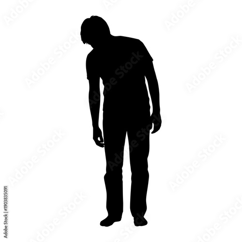Man standing in contemplative pose with head bowed down